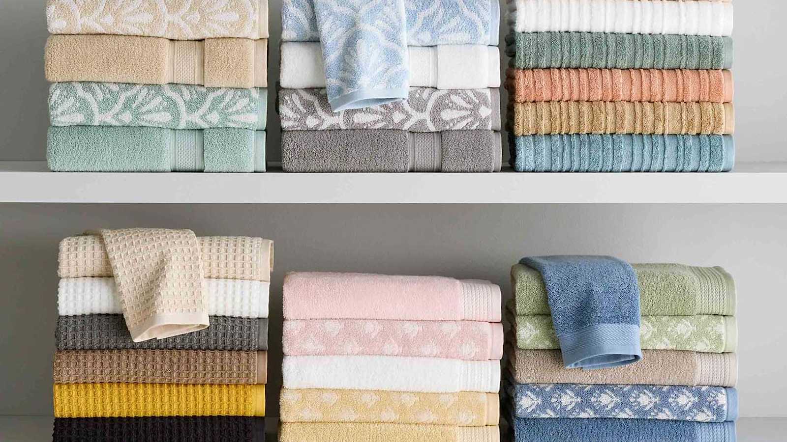 Grey towels folded on marble